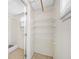 Walk-in closet with tile flooring, built-in shelving and a window offering natural light at 1120 45Th N St, St Petersburg, FL 33713