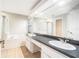 Bathroom with double sinks, large mirror, soaking tub, and separate glass enclosed shower at 11226 Thicket Ct, Tampa, FL 33624