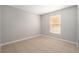 Neutral bedroom with a closet, a window, and tile flooring at 11226 Thicket Ct, Tampa, FL 33624
