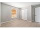 Comfortable bedroom with a closet, a window, and tile flooring at 11226 Thicket Ct, Tampa, FL 33624