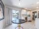 Open kitchen view leading out to backyard pool, complete with white cabinets and modern appliances at 11397 122Nd Ave, Largo, FL 33778