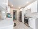 A recently remodeled kitchen features modern, all white cabinets and stainless steel appliances at 11397 122Nd Ave, Largo, FL 33778