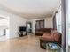 Bright living room with a comfortable sectional, TV, and view into the updated kitchen at 11397 122Nd Ave, Largo, FL 33778
