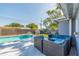 Backyard view of pool, patio, and lounge seating area, ideal for relaxation and entertainment at 11397 122Nd Ave, Largo, FL 33778