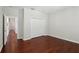 Bedroom highlighting hardwood floors and a closet with double doors for efficient storage at 12817 Darby Ridge Dr, Tampa, FL 33624