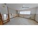Picture showcasing a bedroom with a window, ceiling fan, and track lighting; needs a complete remodel at 1311 Sea Gull S Dr, St Petersburg, FL 33707