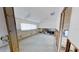 Picture showcasing a bedroom with windows, ceiling fan, and track lighting; needs a complete remodel at 1311 Sea Gull S Dr, St Petersburg, FL 33707