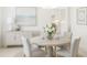 Elegant dining room with a round table, seating for four, and stylish decor at 1311 Sea Gull S Dr, St Petersburg, FL 33707
