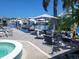 Patio seating and hot tub with a view of the water and boats docked nearby at 1311 Sea Gull S Dr, St Petersburg, FL 33707