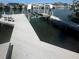 Private boat dock featuring boatlift, seating and waterfront views, ideal for boating enthusiasts at 1311 Sea Gull S Dr, St Petersburg, FL 33707