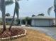 Charming single-story home with a well-maintained yard and a two-car garage at 1311 Sea Gull S Dr, St Petersburg, FL 33707