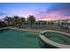 Beautiful pool and spa area with waterfront views, palm trees, and ample space for outdoor living at 1311 Sea Gull S Dr, St Petersburg, FL 33707