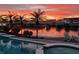 Outdoor pool with waterfront views and scenic sunset backdrop at 1311 Sea Gull S Dr, St Petersburg, FL 33707
