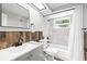 Beautiful bathroom featuring a white vanity, modern fixtures, and a shower-over-tub at 1427 Gerard Ln, Holiday, FL 34690