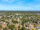 Broad aerial perspective of a leafy suburb, featuring homes and clear views to the horizon at 1601 54Th S St, Gulfport, FL 33707