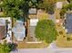 Overhead shot showing a home with a spacious yard, mature trees, and a detached garage at 1601 54Th S St, Gulfport, FL 33707