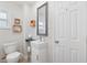 Compact bathroom featuring a modern sink, mirror, and charming decorative accents at 1601 54Th S St, Gulfport, FL 33707