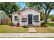 Lovely single-story home boasts mature trees, a well-manicured lawn, and an inviting entrance flying an American flag at 1601 54Th S St, Gulfport, FL 33707
