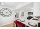Bright and modern kitchen with white cabinetry, stainless steel appliances, and a large center island with barstools at 1601 54Th S St, Gulfport, FL 33707