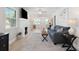 Cozy living room with a fireplace, comfortable seating, and plenty of natural light at 1601 54Th S St, Gulfport, FL 33707