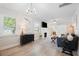 Bright living room featuring a decorative fireplace, comfortable seating, and ample natural light at 1601 54Th S St, Gulfport, FL 33707