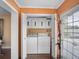 Functional laundry room area with washer, dryer, and cabinet storage at 1702 Cordova Green, Seminole, FL 33777