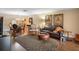 Inviting living room with hardwood floors, stylish rug, leather sofa, and elegant decor at 1702 Cordova Green # 1702, Seminole, FL 33777