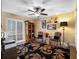 Cozy office space with shuttered window, ceiling fan, and elegant decor elements at 1702 Cordova Green, Seminole, FL 33777