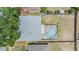 Aerial view of the home showcasing the roof and screened in private pool at 1912 Blue Sage Ct, Brandon, FL 33511