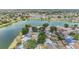 Panoramic aerial view of a residential neighborhood with lake access and lush green surroundings at 1912 Blue Sage Ct, Brandon, FL 33511