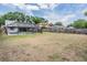 Large fenced back yard with ample space for entertaining and a private screened-in pool at 1912 Blue Sage Ct, Brandon, FL 33511