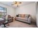 Comfortable second bedroom includes neutral carpet, updated lighting, and lots of closet space at 1912 Blue Sage Ct, Brandon, FL 33511