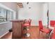 Spacious dining room featuring a bar area, hardwood floors, and pass-through to the kitchen at 1912 Blue Sage Ct, Brandon, FL 33511