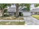 Charming single-story home featuring mature landscaping, a two-car garage and a well-maintained lawn at 1912 Blue Sage Ct, Brandon, FL 33511