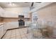 Bright kitchen with white cabinetry, stainless steel appliances, and breakfast nook at 1912 Blue Sage Ct, Brandon, FL 33511
