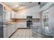 Well-lit kitchen with white cabinetry, stainless steel appliances and a cozy breakfast nook at 1912 Blue Sage Ct, Brandon, FL 33511