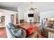 Bright living room boasts vaulted ceilings, hardwood floors, fireplace, and ample natural light at 1912 Blue Sage Ct, Brandon, FL 33511