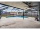 Private backyard pool under screen enclosure with covered and uncovered patio space at 1912 Blue Sage Ct, Brandon, FL 33511