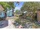 Private backyard featuring a shed, gazebo, mature trees and outdoor seating at 2014 E Broad St, Tampa, FL 33610
