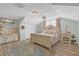 Charming bedroom featuring hardwood floors, unique decor, and a comfortable bed with pink accents at 2014 E Broad St, Tampa, FL 33610
