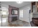 Hallway features brick accent wall, decorative mirror, and access to the kitchen at 2014 E Broad St, Tampa, FL 33610