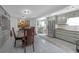 Open concept kitchen with stainless steel appliances, marble countertops and dining area at 2014 E Broad St, Tampa, FL 33610