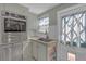 Charming kitchen with built-in oven, stainless steel appliances, and unique cabinet design at 2014 E Broad St, Tampa, FL 33610