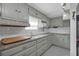 Functional kitchen with white subway tile backsplash and ample cabinet space at 2014 E Broad St, Tampa, FL 33610