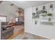 Cozy living room with a stone fireplace, wood beams, and decorative shelving at 2014 E Broad St, Tampa, FL 33610