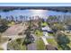 Expansive aerial view showcases the property's location near a beautiful lake and lush greenery at 21918 Shamu Dr, Land O Lakes, FL 34639