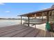Boat dock with boat lift showcasing a waterfront lifestyle with easy access to the open lake at 21918 Shamu Dr, Land O Lakes, FL 34639