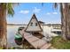 Quaint A-frame boathouse on a dock with clear water access and picturesque lake surroundings at 21918 Shamu Dr, Land O Lakes, FL 34639