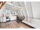 Charming interior of A-frame featuring a kitchen and living space with a unique and airy design at 21918 Shamu Dr, Land O Lakes, FL 34639