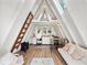 Cozy A-frame home interior with a living space and functional kitchen, offering a modern and unique style at 21918 Shamu Dr, Land O Lakes, FL 34639